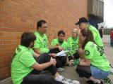 MOE's comp and strategy team strategize about the game with mentors during the competition.